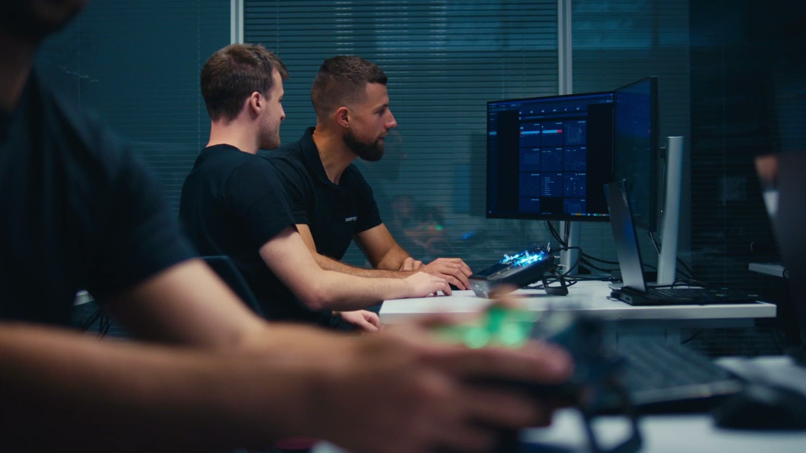 Instructor and trainee at a simulator station